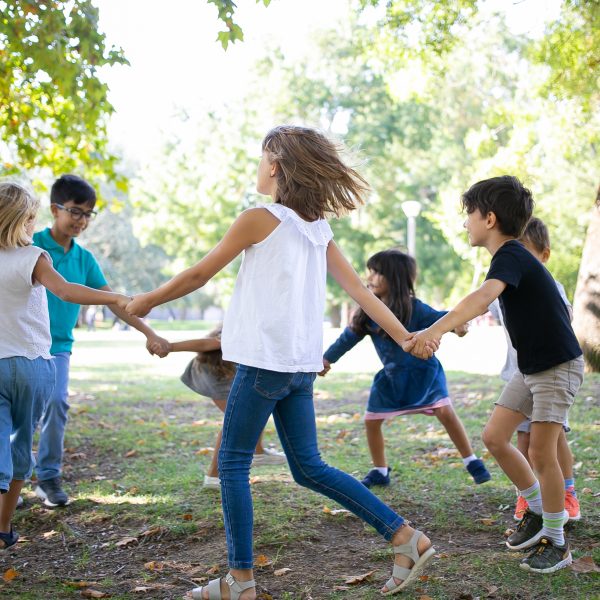 group children holding hands dancing around enjoying outdoor activities having fun park kids party friendship concept - FiZ Leipzig