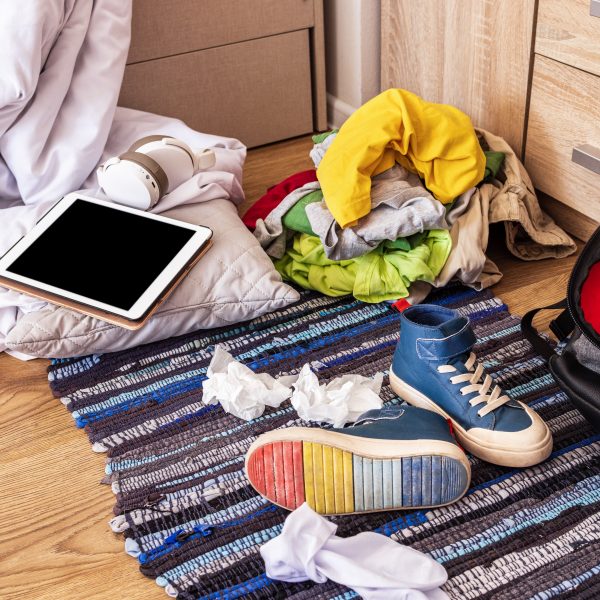 clothes sneakers backpack are scattered floor teenager s room - FiZ Leipzig